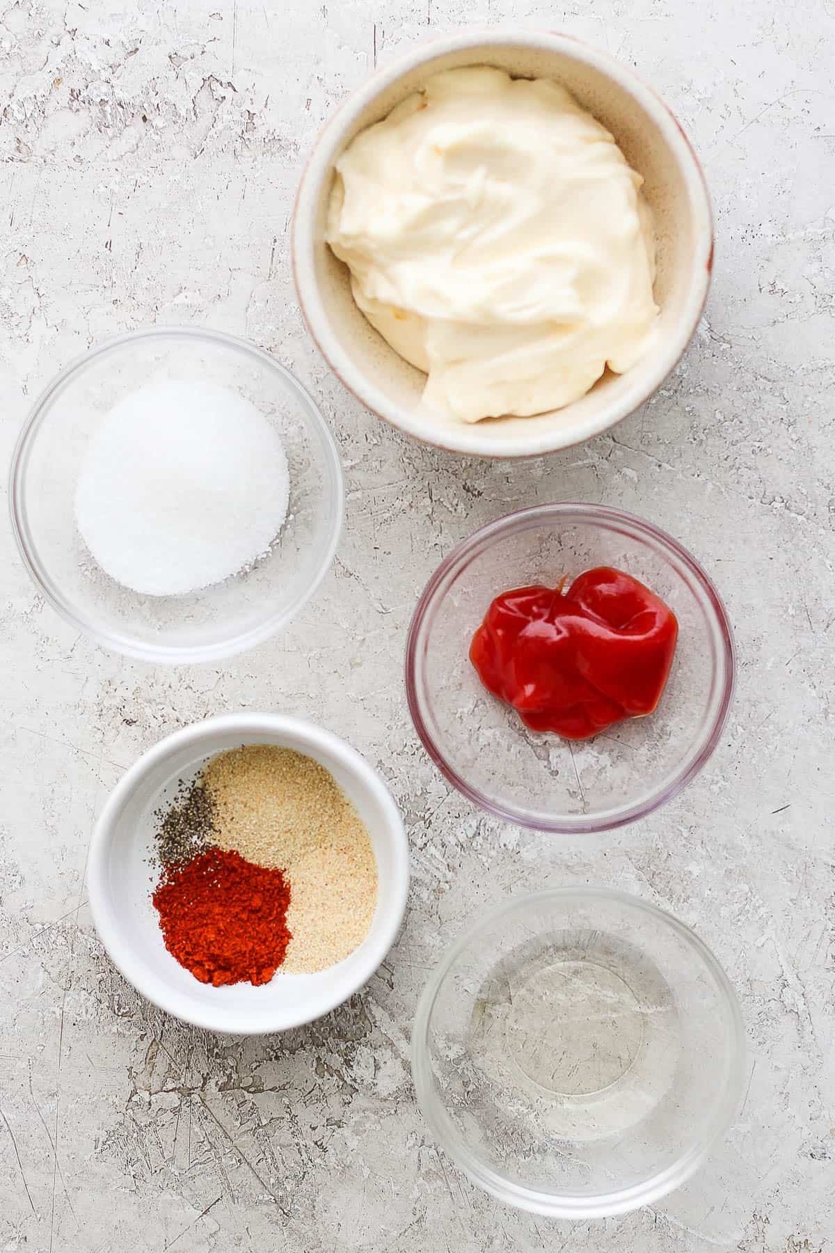 Yum yum sauce ingredients in small bowls.