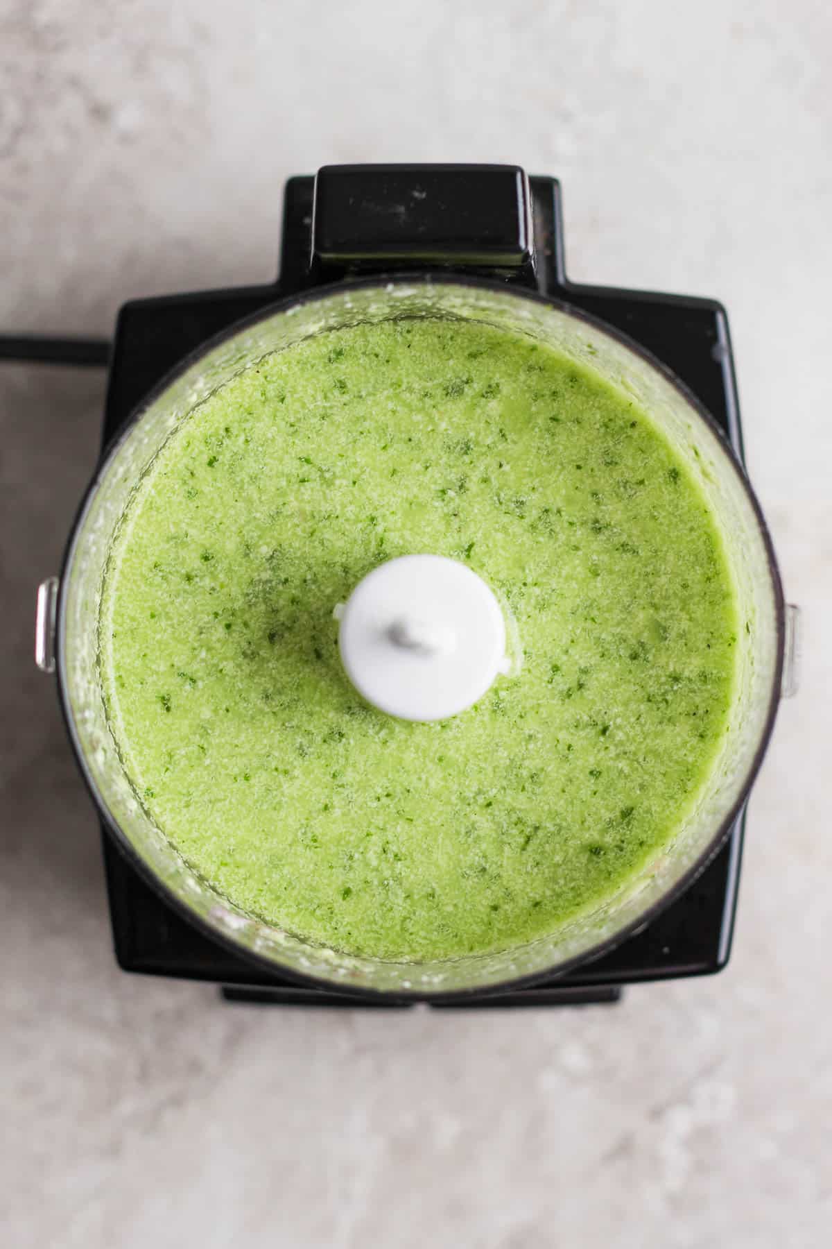 Avocado salad dressing in a food processor.