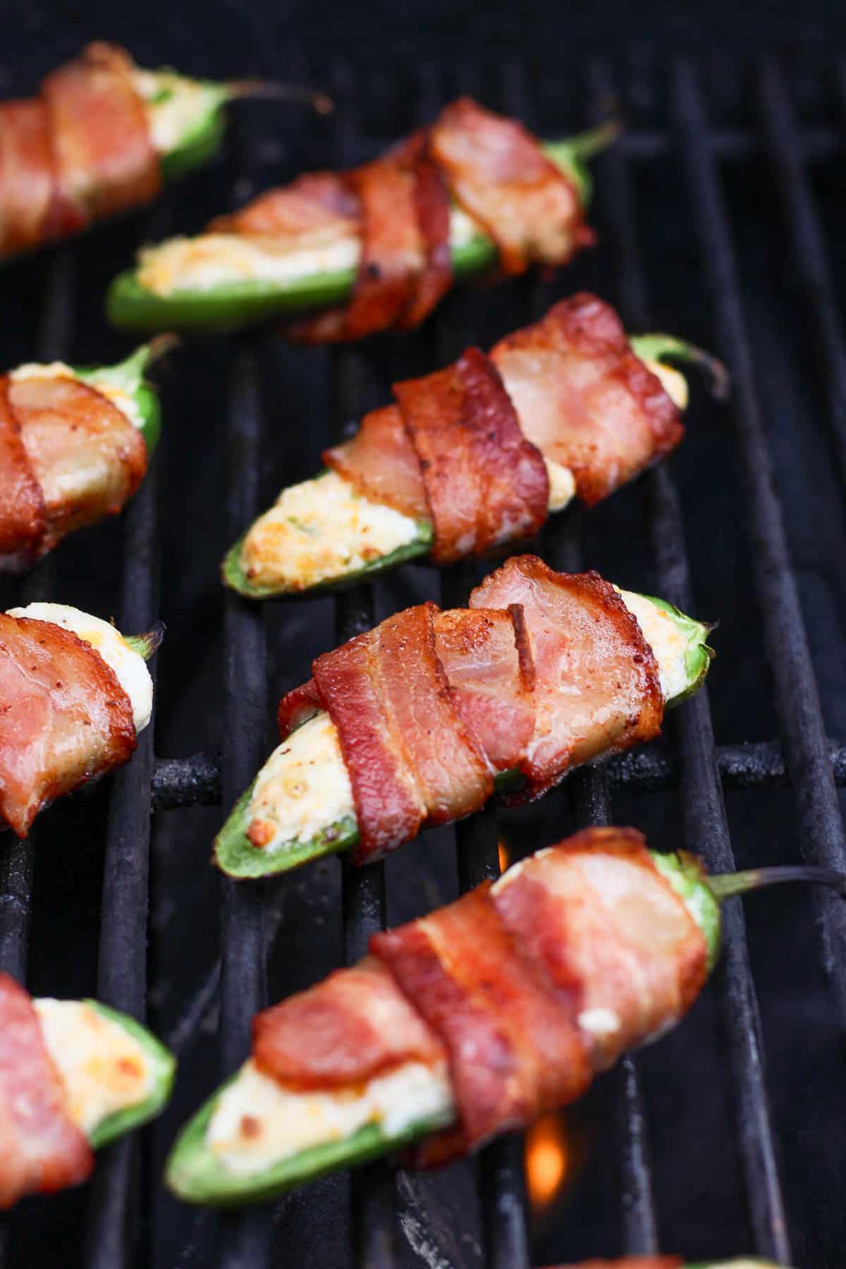 Bacon wrapped jalapeño poppers on the grill.