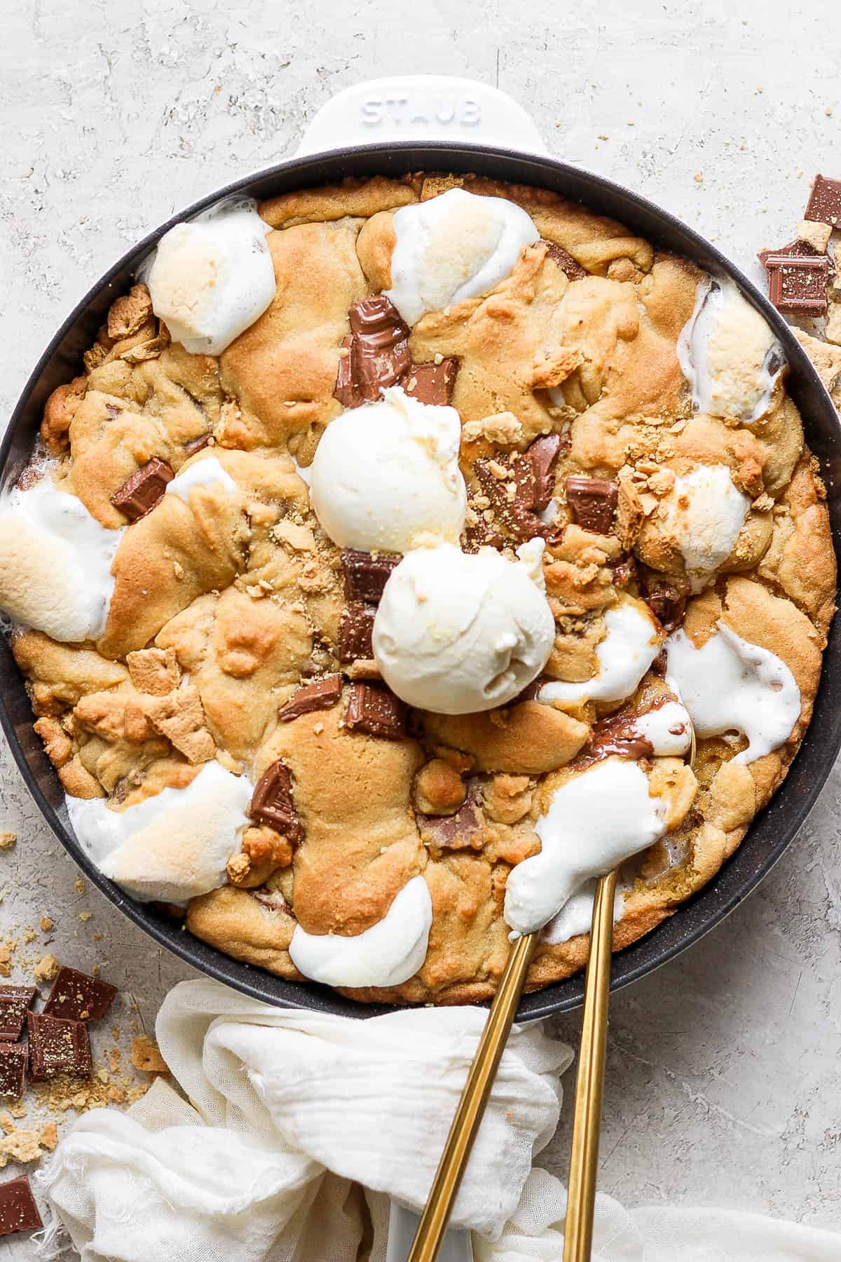 Scoops of vanilla ice cream added to the cookie skillet.