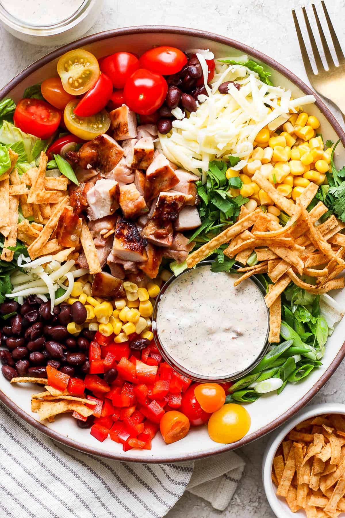 A fully assembled tex mex salad in a large bowl.