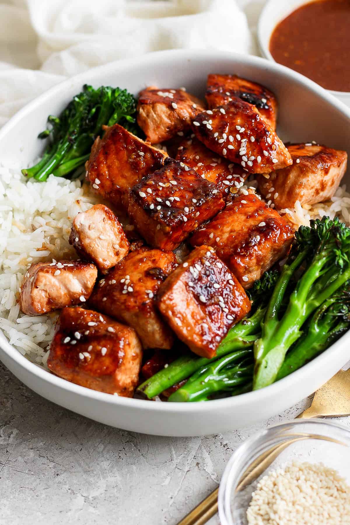 Blackstone salmon bites on top of a rice bowl.