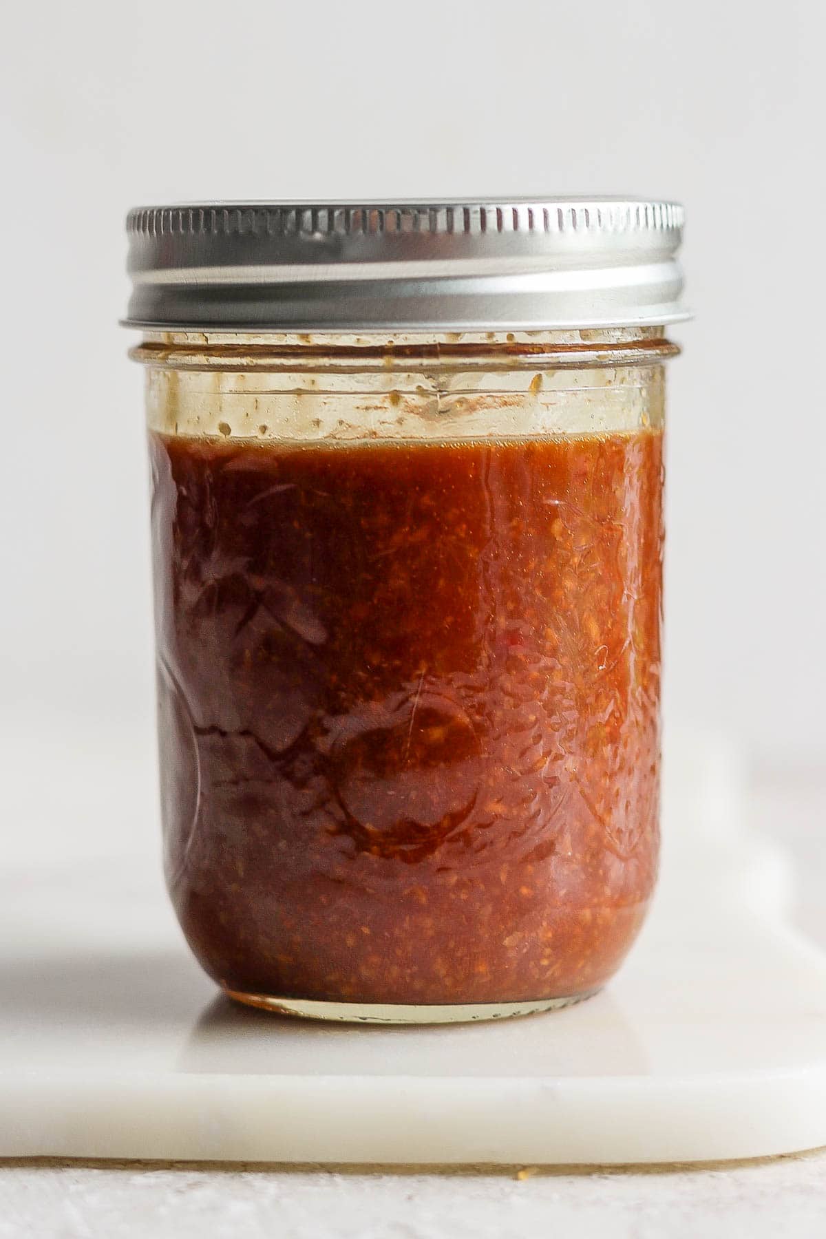 A mason jar of the mixed garlic soy sauce.