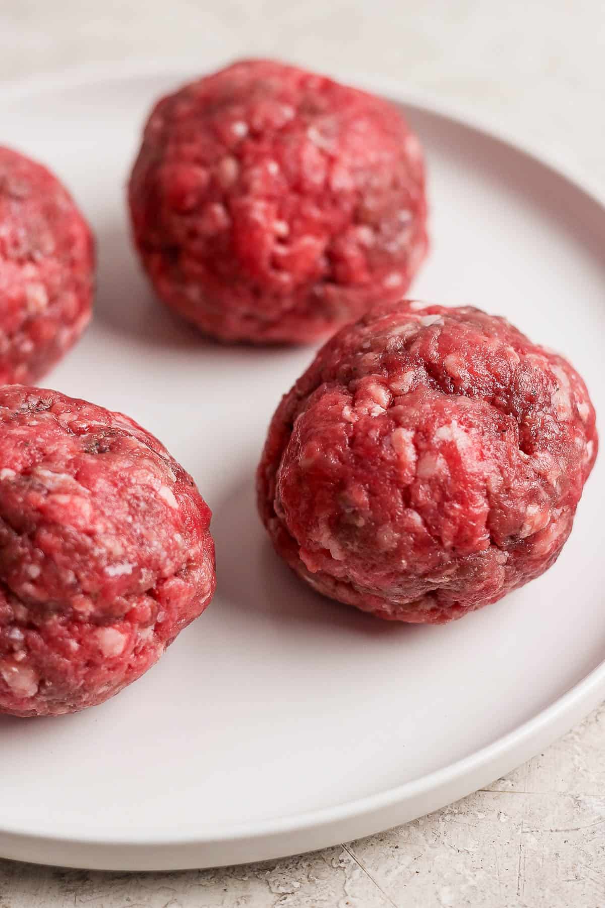 Burger balls on a white plate.