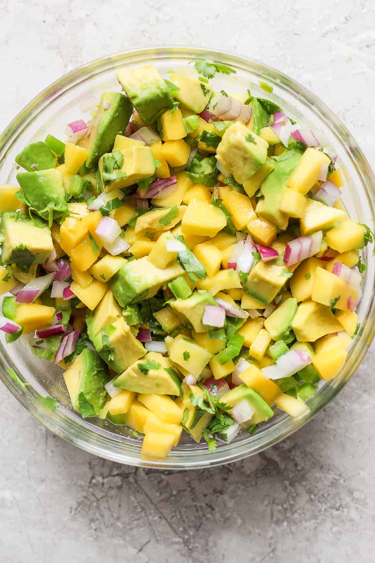 The mango avocado salsa in a glass bowl.