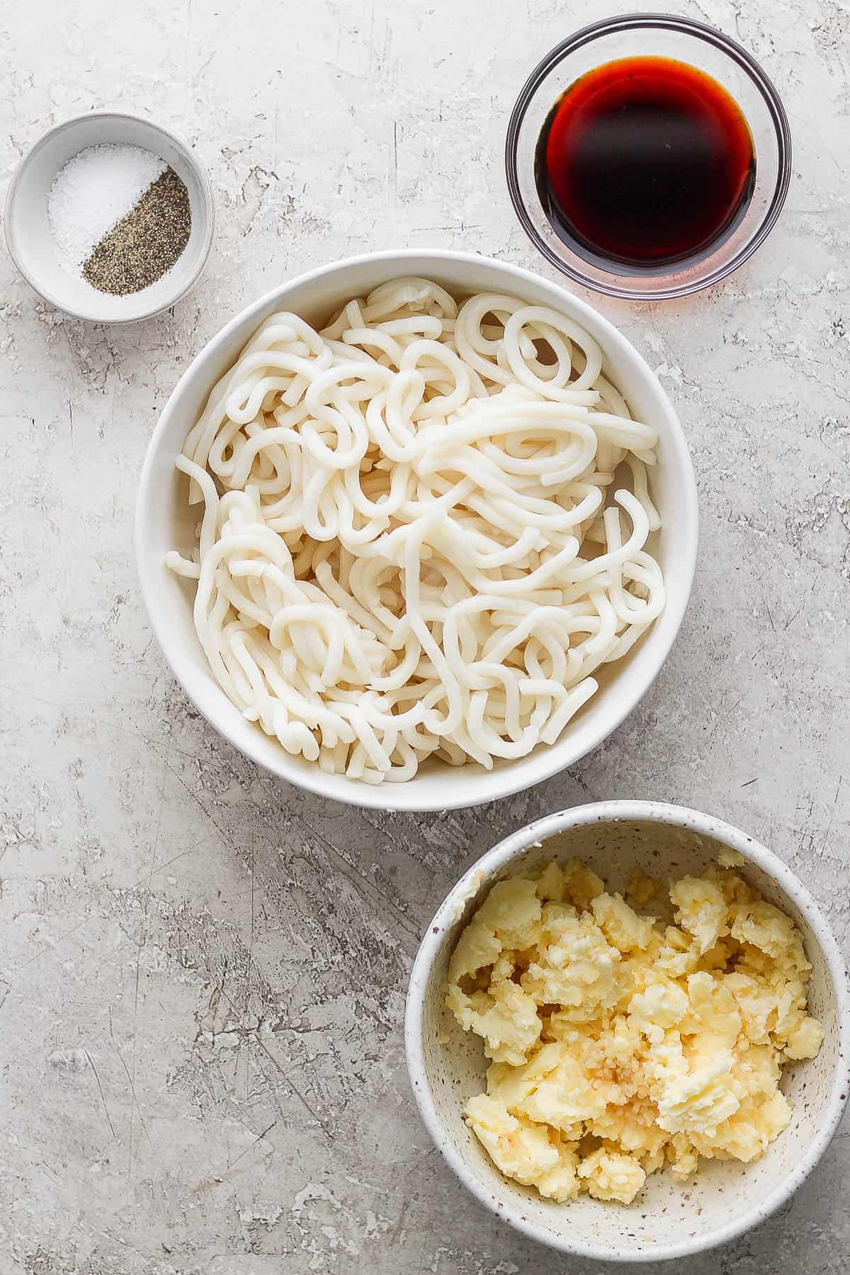 Ingredients for hibachi noodles in separate bowls.