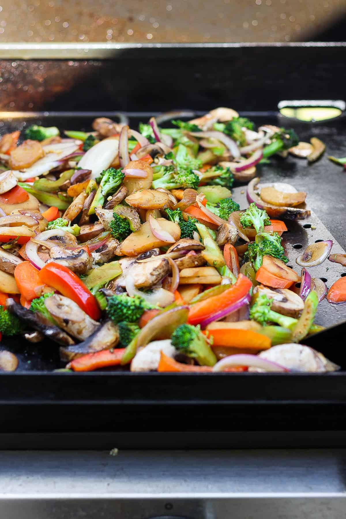 All of the cooked veggies on the flat top.