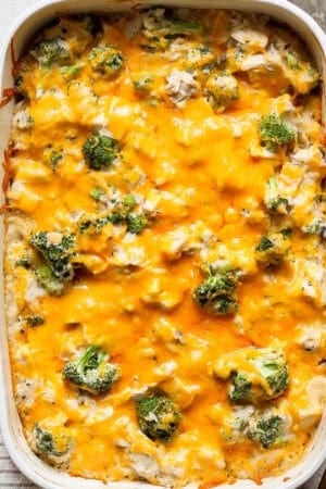 Top down shot of a casserole dish filled with broccoli chicken and rice with cheese.