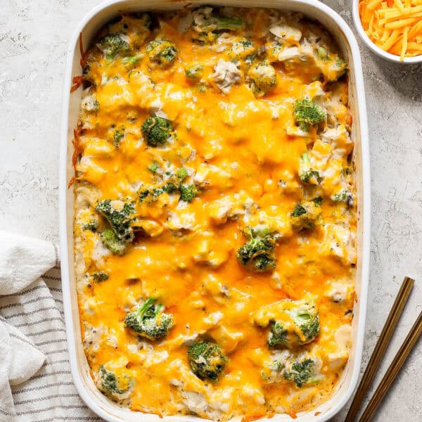 Top down shot of a casserole dish filled with broccoli chicken and rice with cheese.