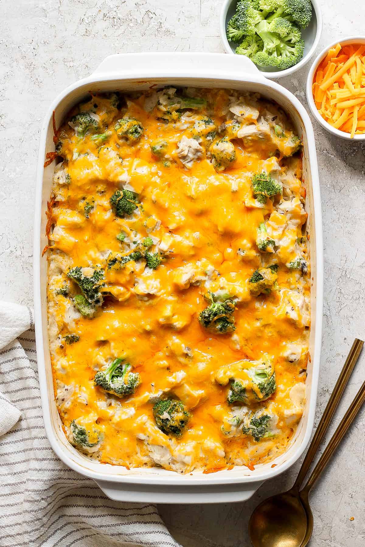 Baked cheesy broccoli and rice casserole in a casserole dish. 