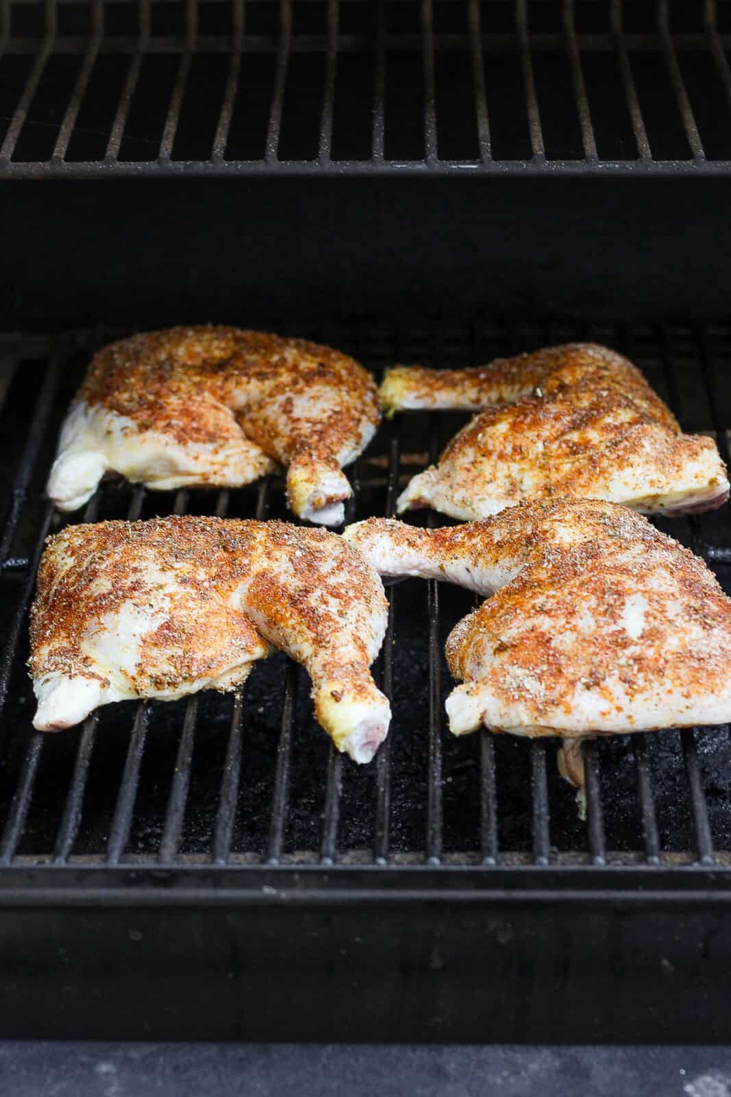 Chicken quarters in smoker.