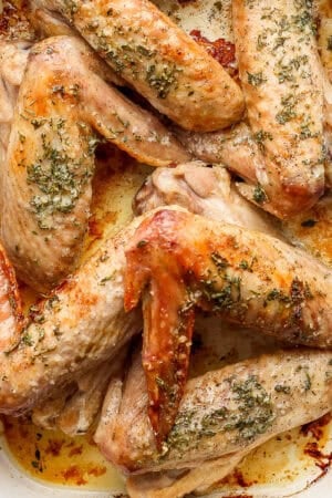 Top down shot of a pan of herbed butter baked turkey wings.