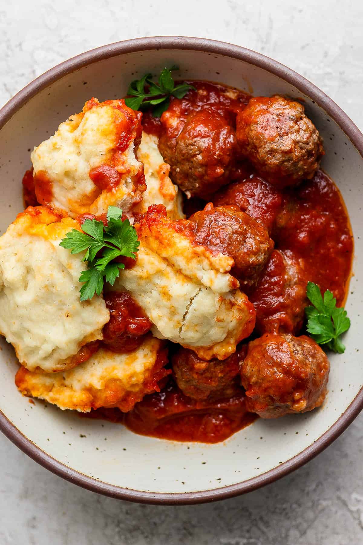 Meatballs and dumplings in a bowl.