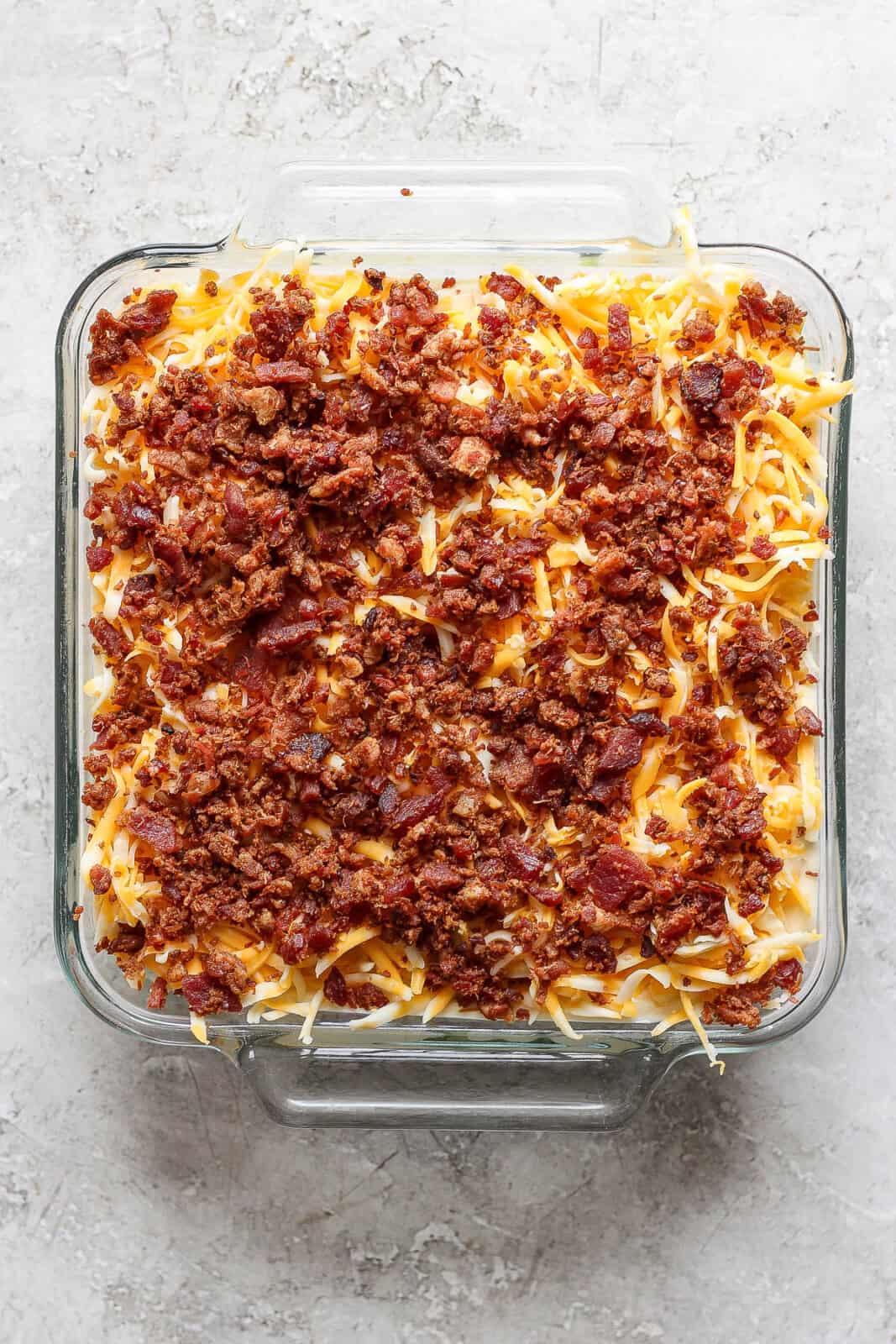 The dressing, cheese and bacon also layered in the glass pan. 