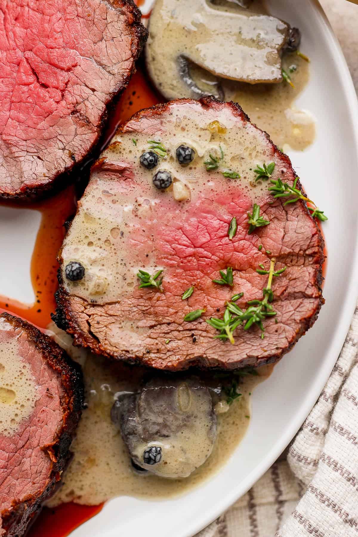 Creamy mushroom sauce over a slice of grilled beef tenderloin.