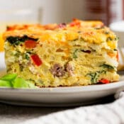A slice a hash brown egg bake on a plate.