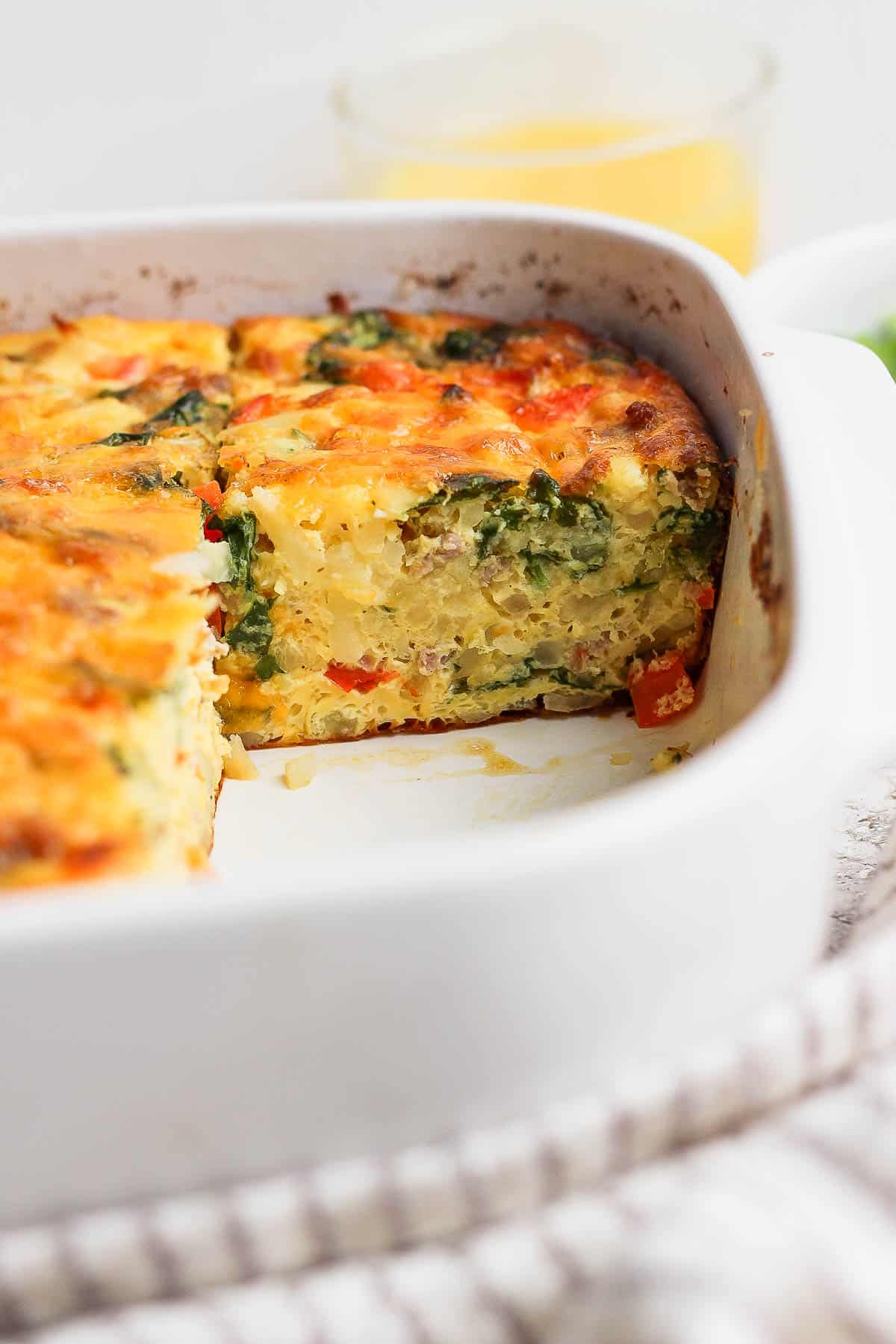 A cut of egg bake taken out of the casserole dish.