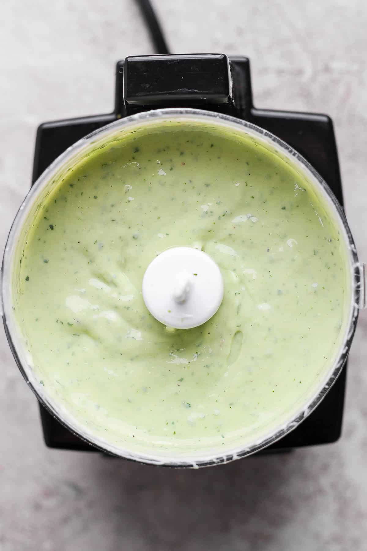 Avocado lime ranch dressing in a small food processor.