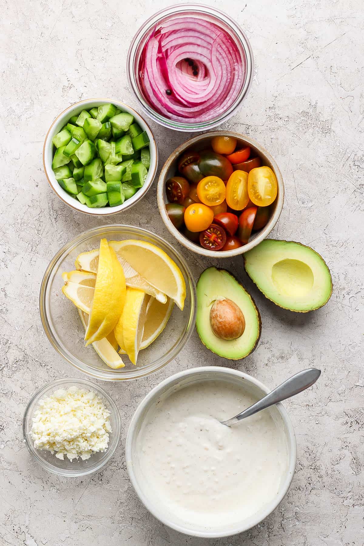 Rice bowl ingredients in separate bowls.