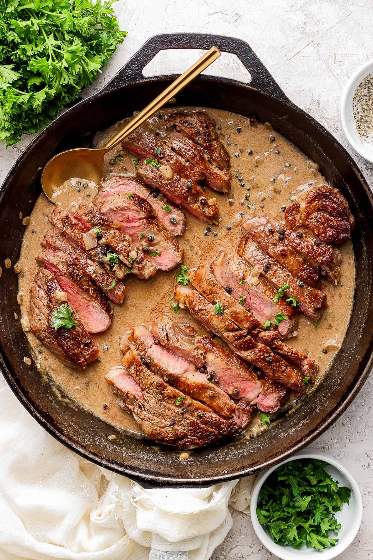 Strips of steak added back to the pan in the sauce.