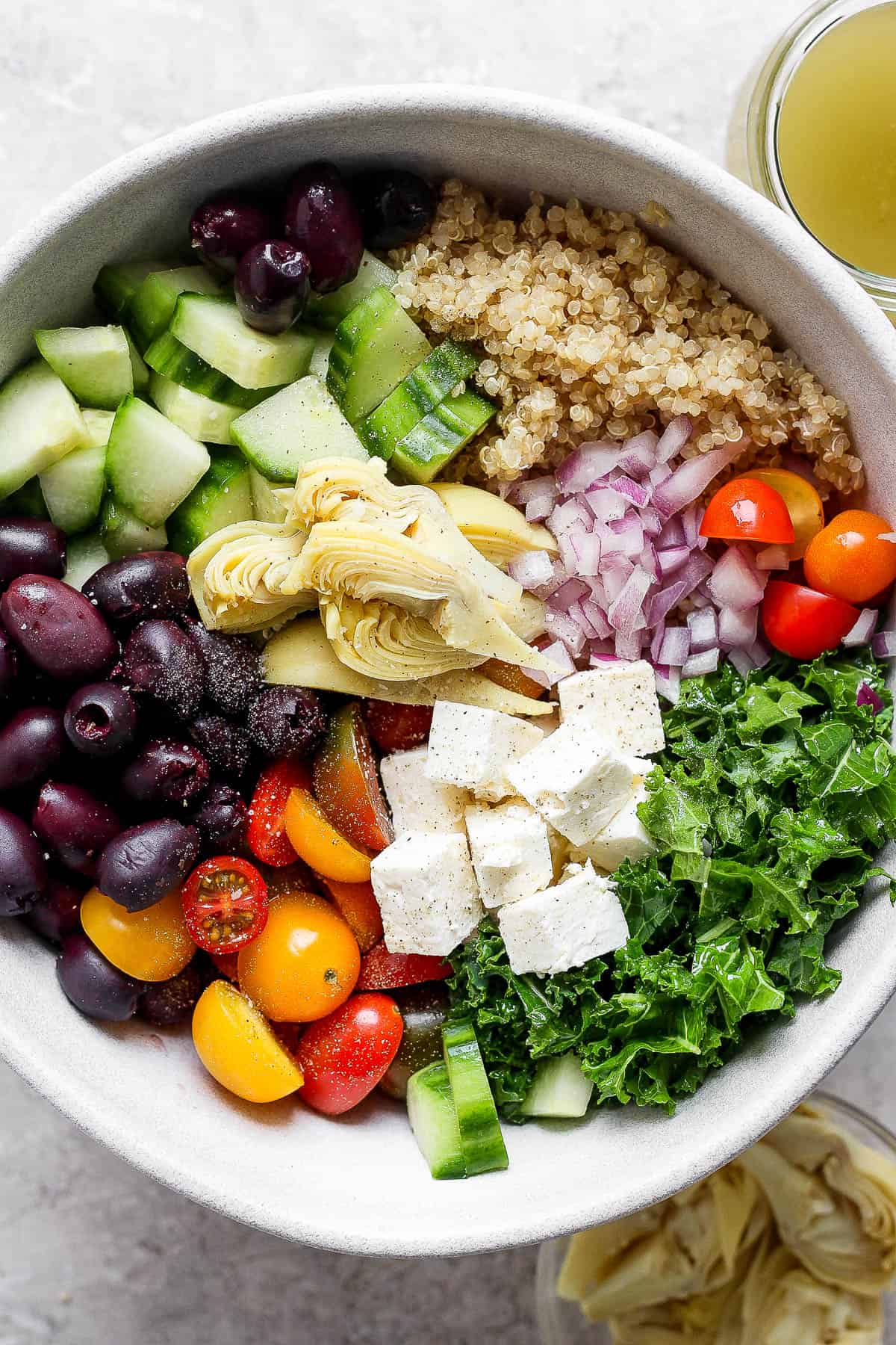 All of the salad ingredients separated in a bowl.