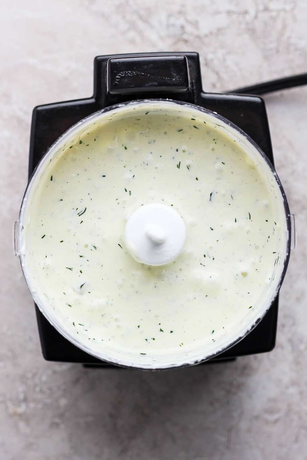 Dill pickle ranch dressing in a food processor blended.
