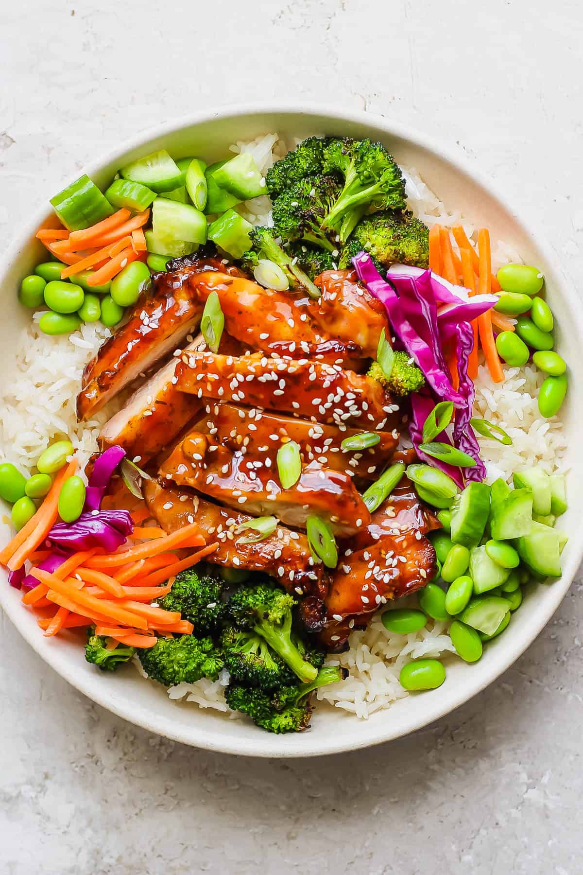 Teriyaki Chicken Bowls - simple and delicious weeknight dinner (or meal prep!) that your whole family will love! (Whole30, Paleo, GF + DF) #teriyakichickenbowls #teriyakichickenbowl #whole30dinner #instantpotmeals #paleodinner #healthychickendinner A grilled chicken teriyaki rice bowl.