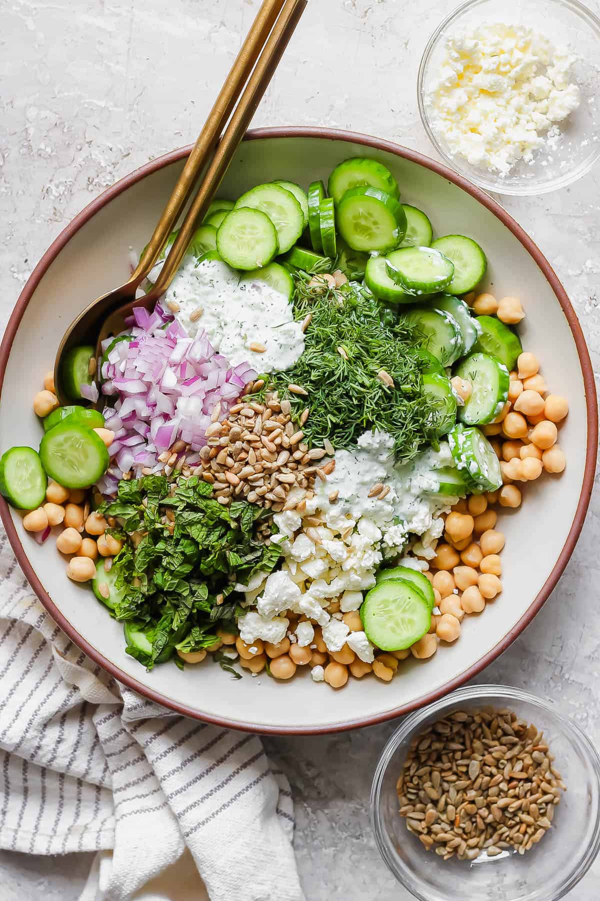 Tzatziki dressing on a cucumber chickpea salad.
