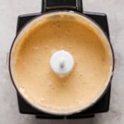 A small food processor filled with chipotle lime sauce.
