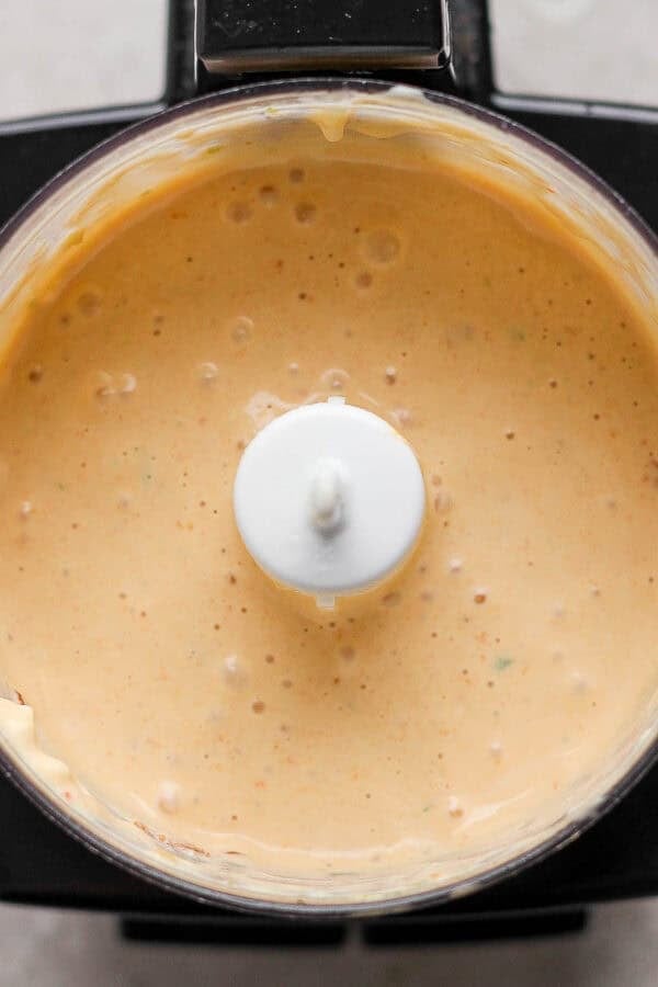 A small food processor filled with chipotle lime sauce.