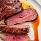 A plate filled with sliced grilled trip tip.