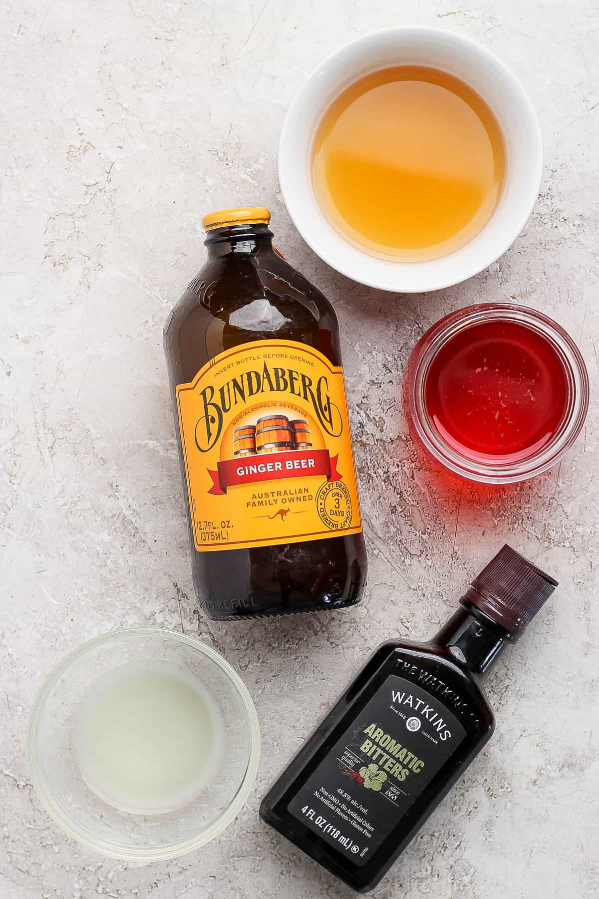 Ingredients for a Kentucky Buck in separate bowls.