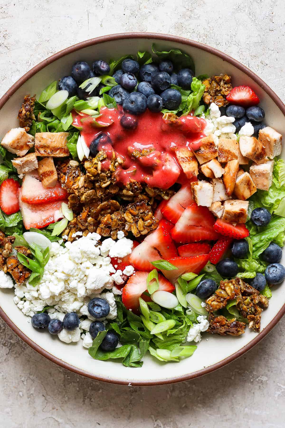The best recipe for a grilled protein chicken salad with a seedy granola crunch on top.