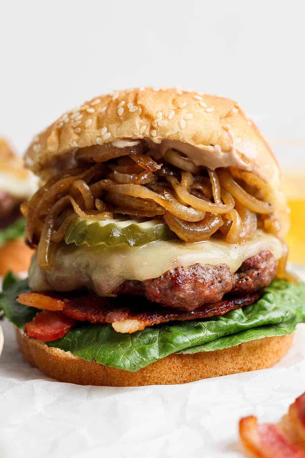 A fully assembled caramelized onion burger.