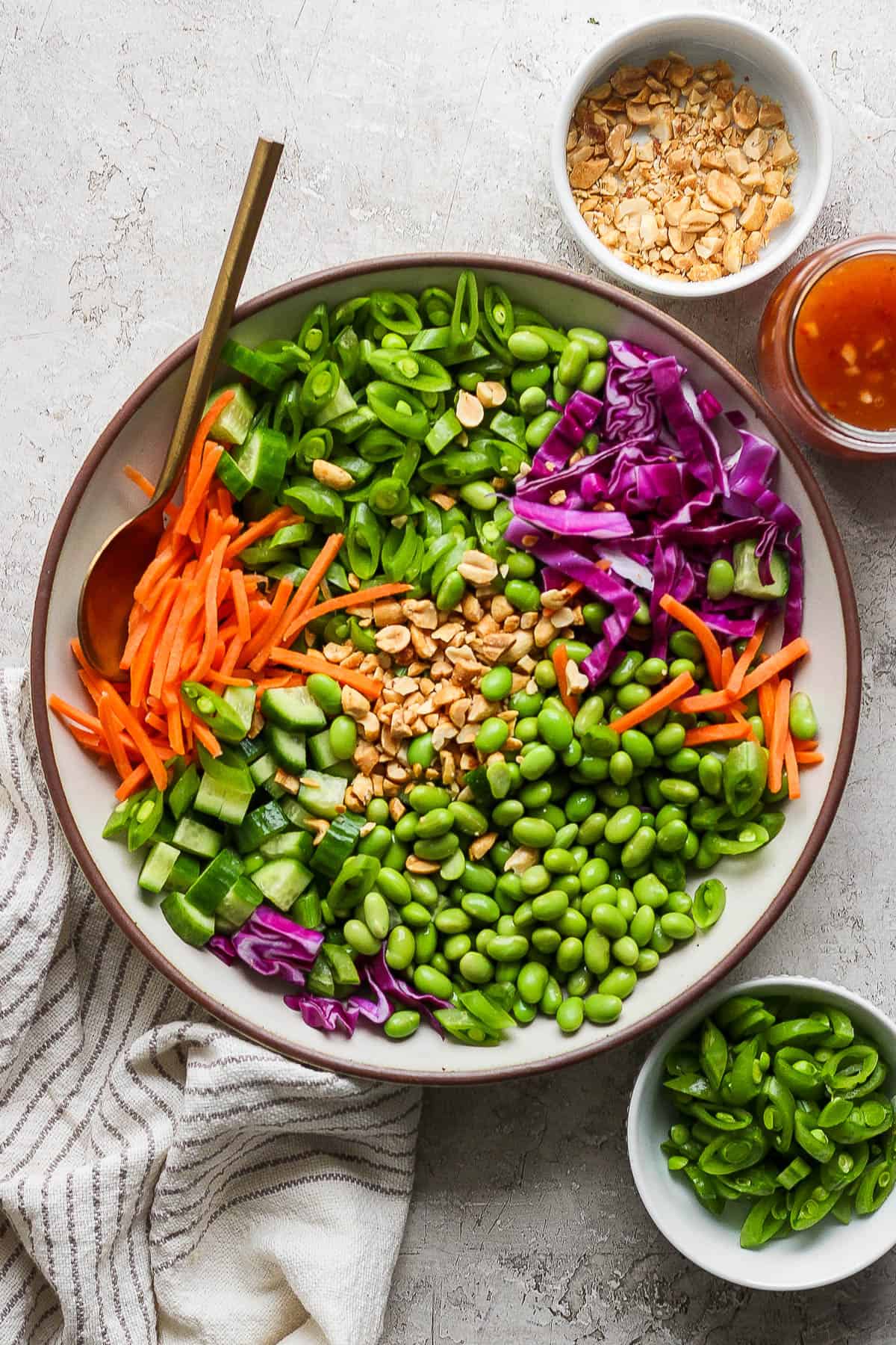 Pea salad assembled in a shallow serving bowl.