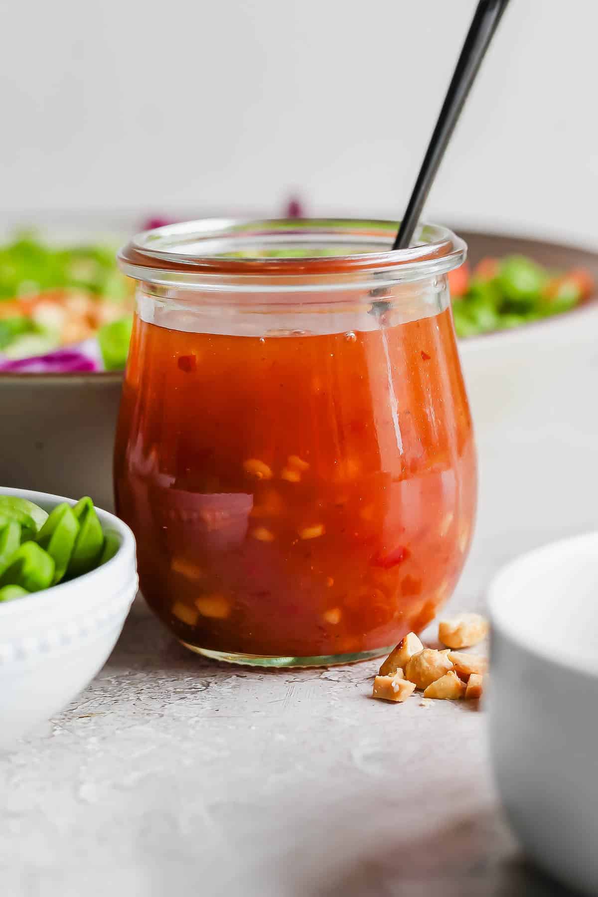 A jar of homemade sweet chili vinaigrette.