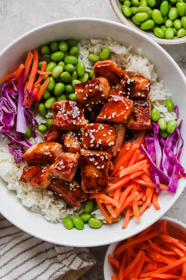 A fully assembled teriyaki salmon rice bowl.