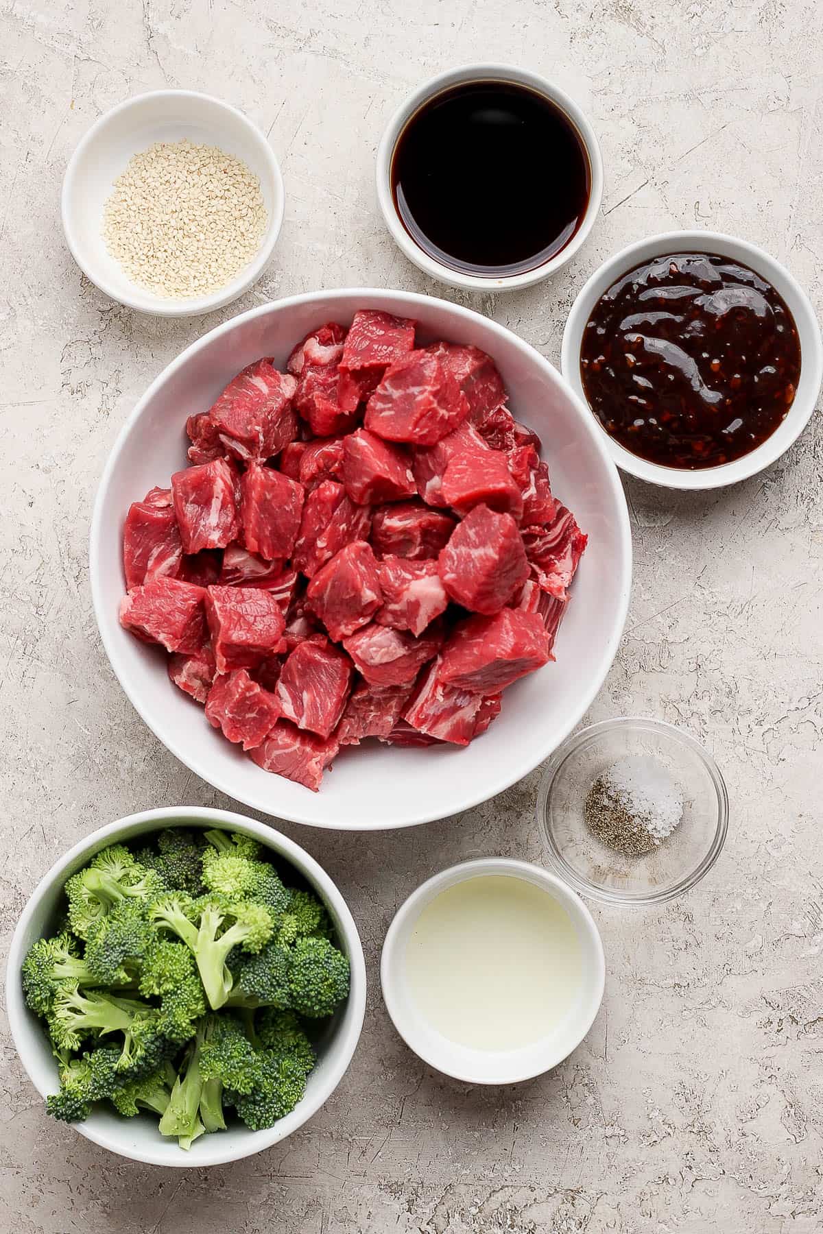 Ingredients for teriyaki steak in separate bowls.