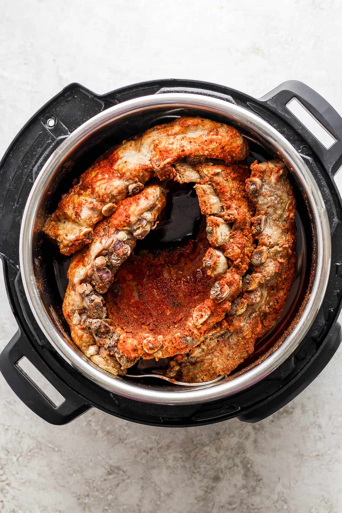 Fully cooked racks of ribs in an Instant Pot.