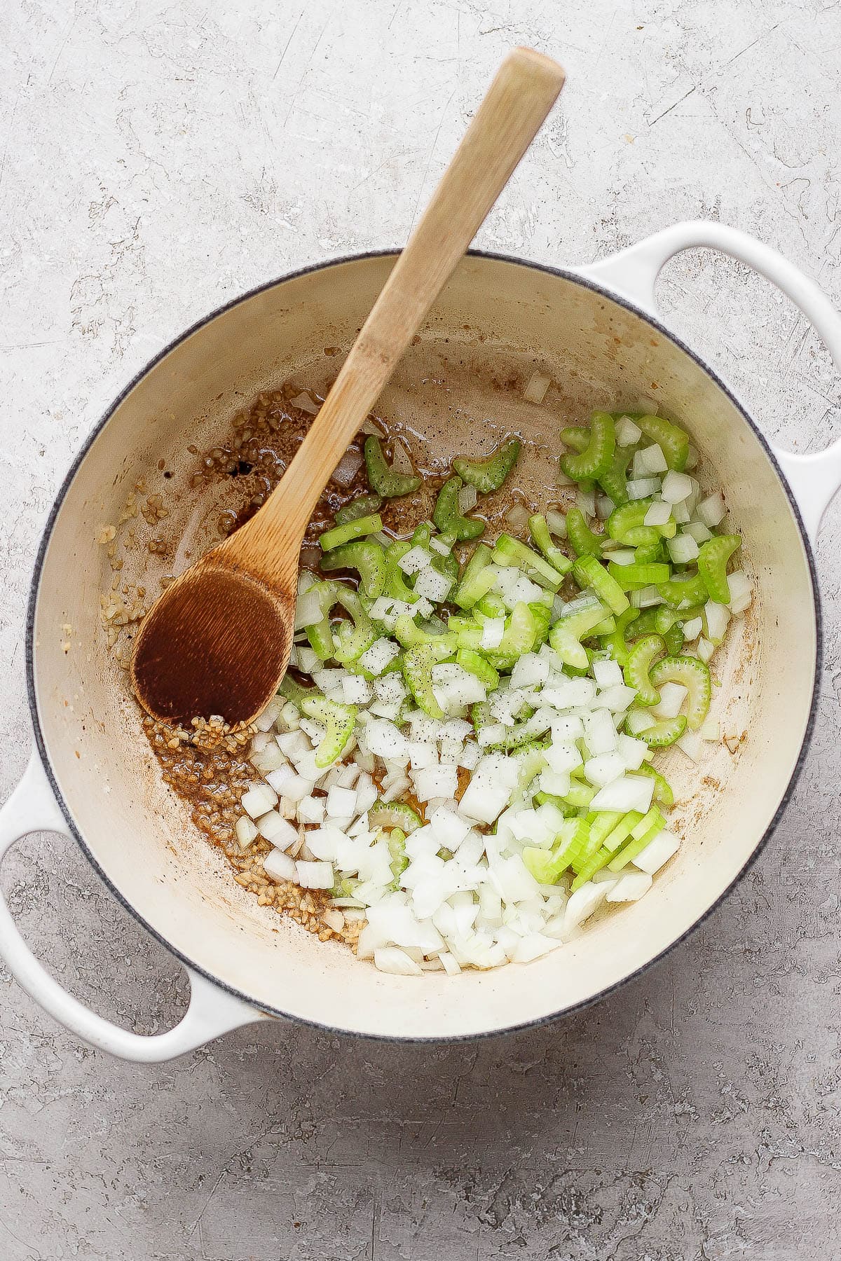 Garlic, onion, and celery sautéing in the pot.
