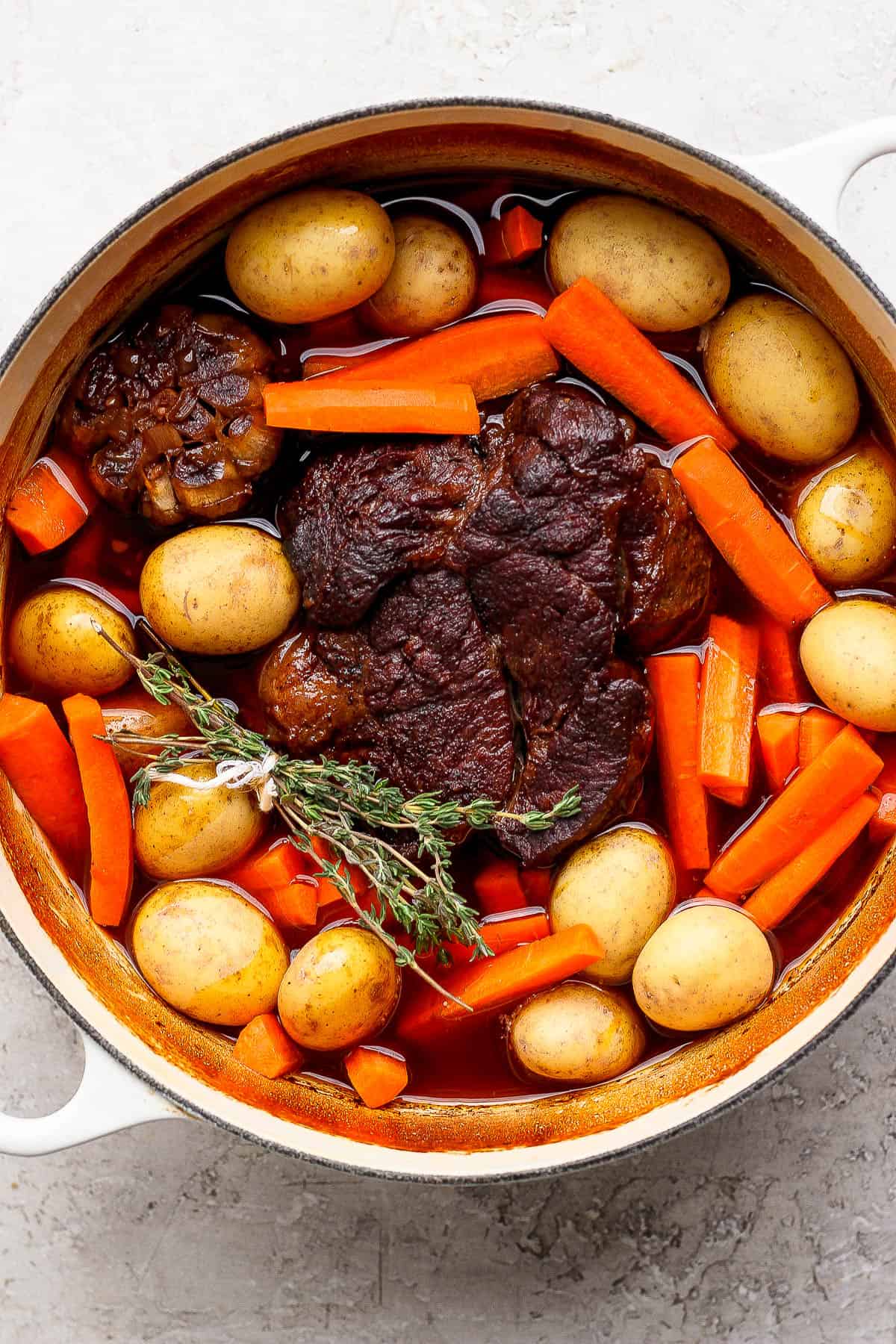The best dutch oven pot roast made with potatoes and carrots.