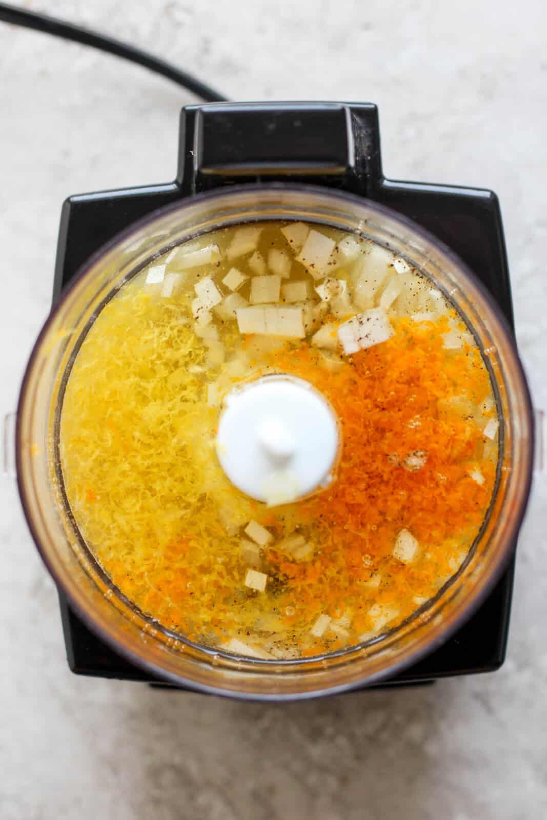 Citrus champagne vinaigrette ingredients in a small food processor.