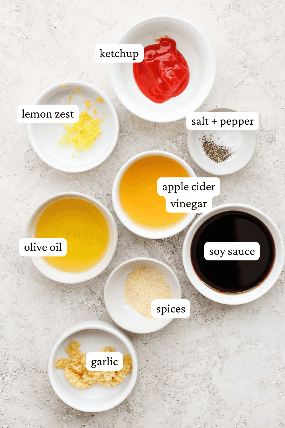 Ingredients for rib marinade in separate bowls with labels.
