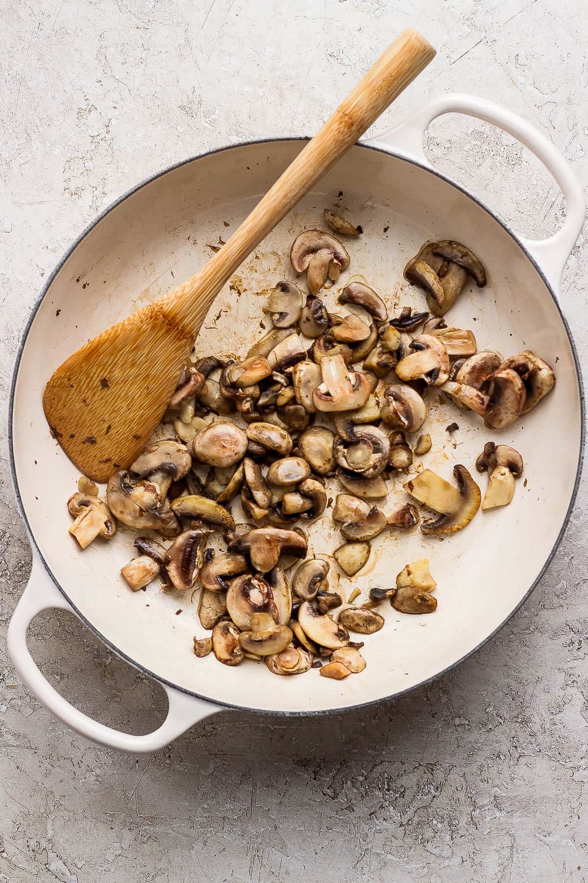 Mushrooms sautéing in a braising pan.
