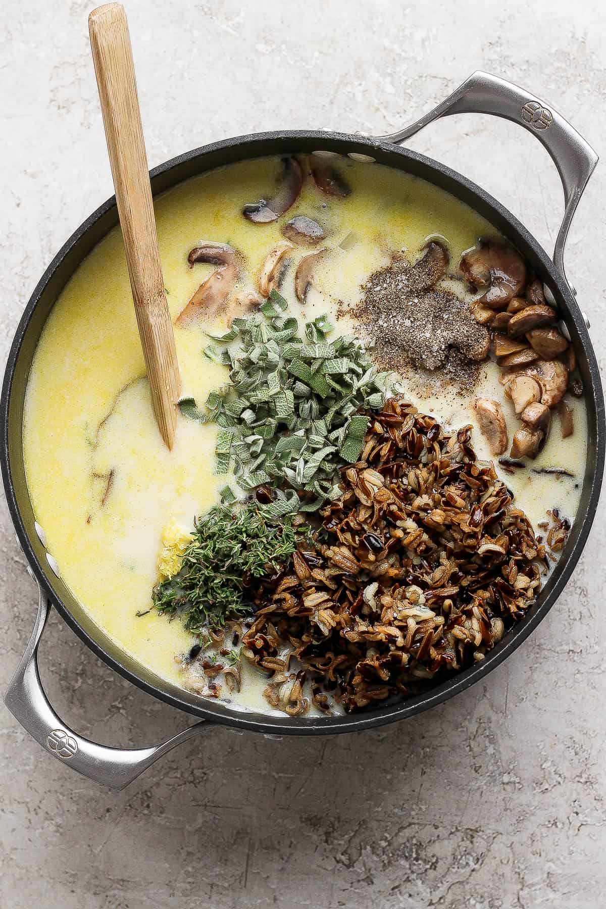 All of the turkey wild rice soup ingredients added to the soup pot but not mixed.