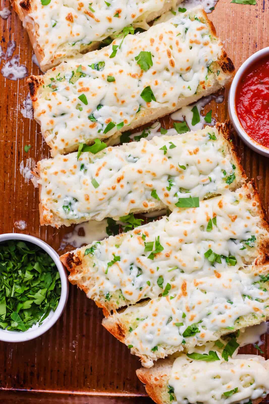 Italian bread Italian dunkers on a baking sheet.