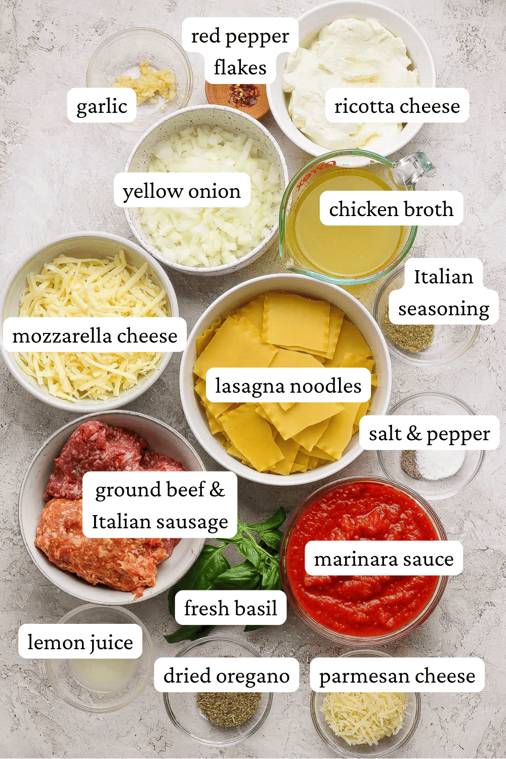 Ingredients for lasagna soup in separate bowls with labels.