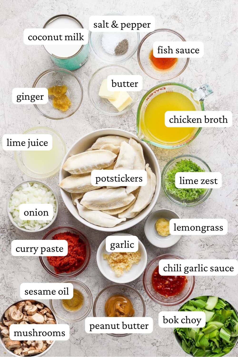 Ingredients for potsticker soup in separate bowls with labels.