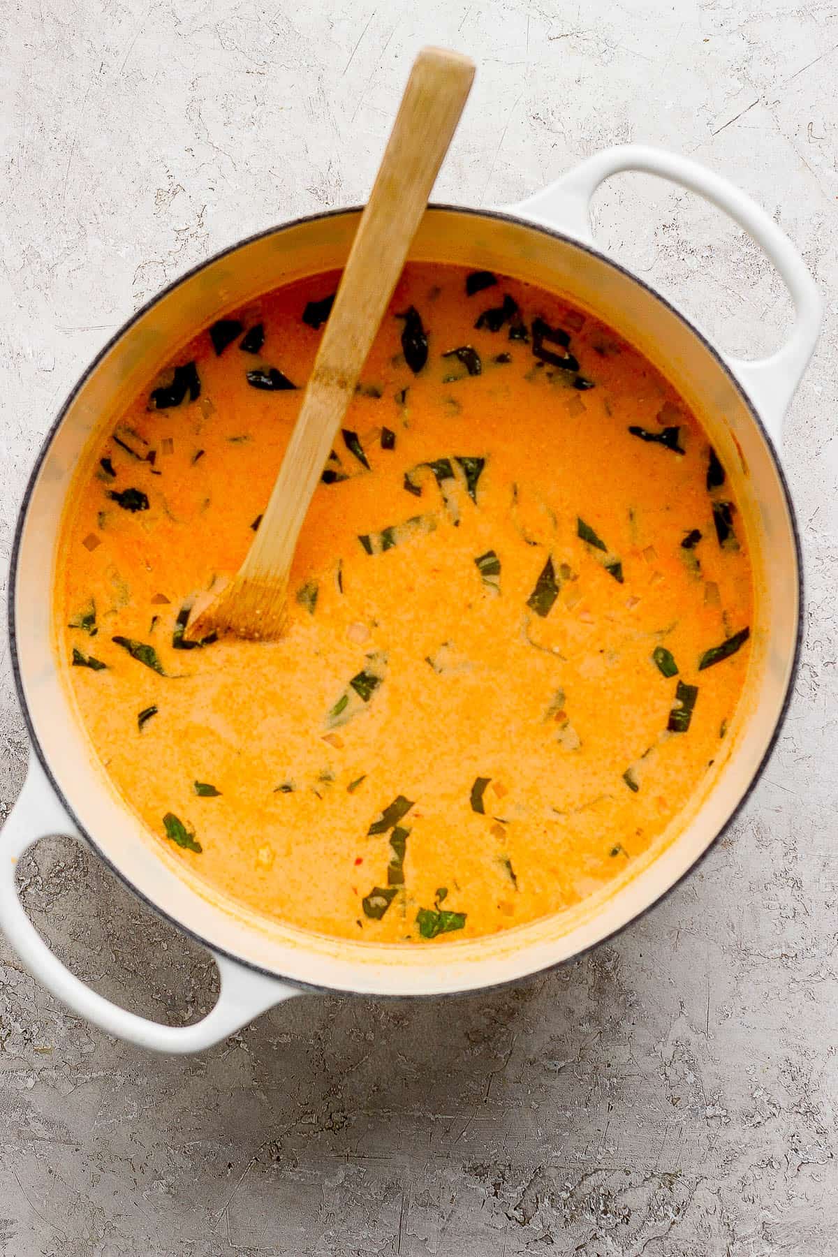 The broth base of potsticker soup being brought to a boil.