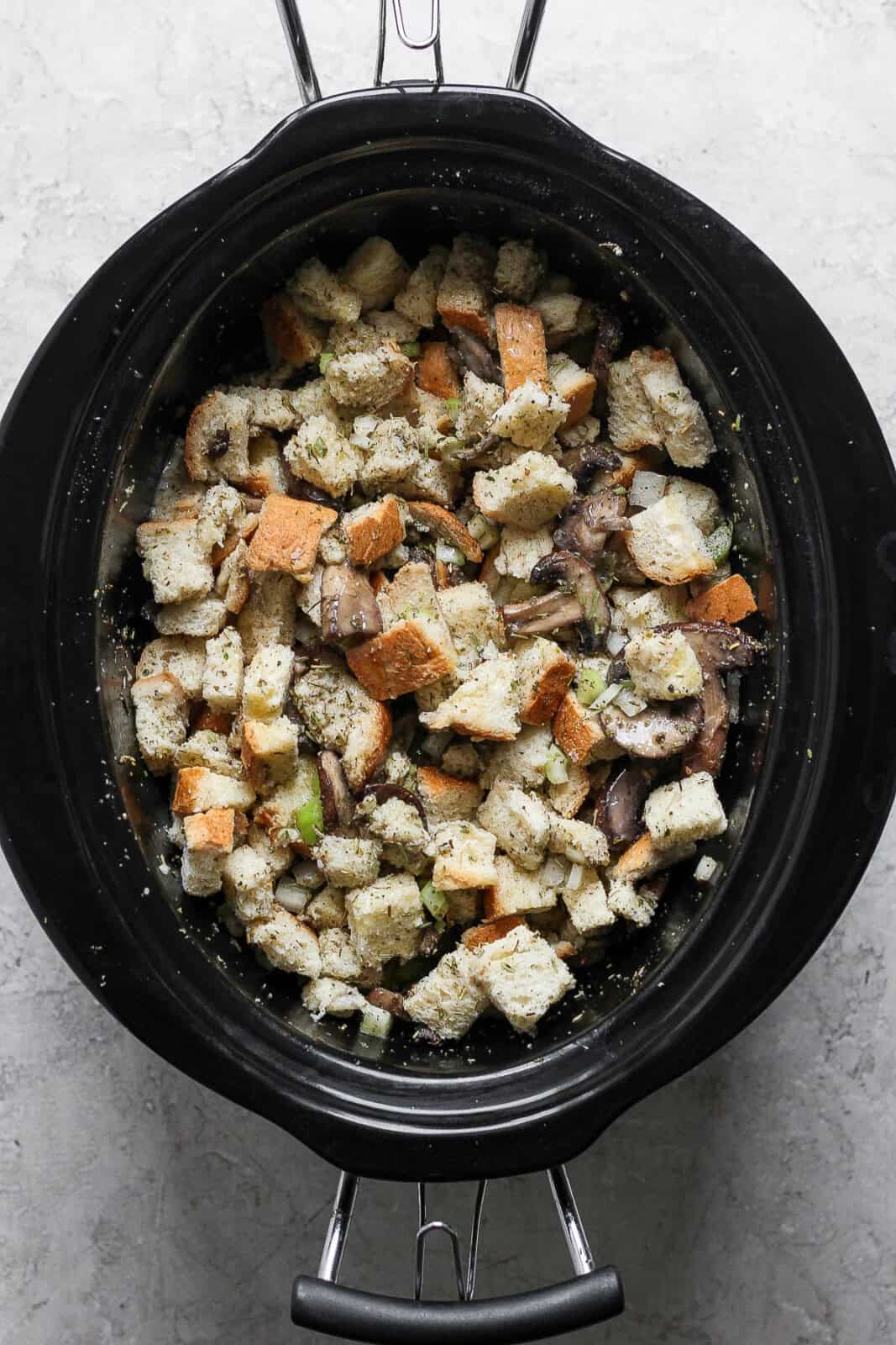 Fully cooked Crock pot stuffing in a crock pot.